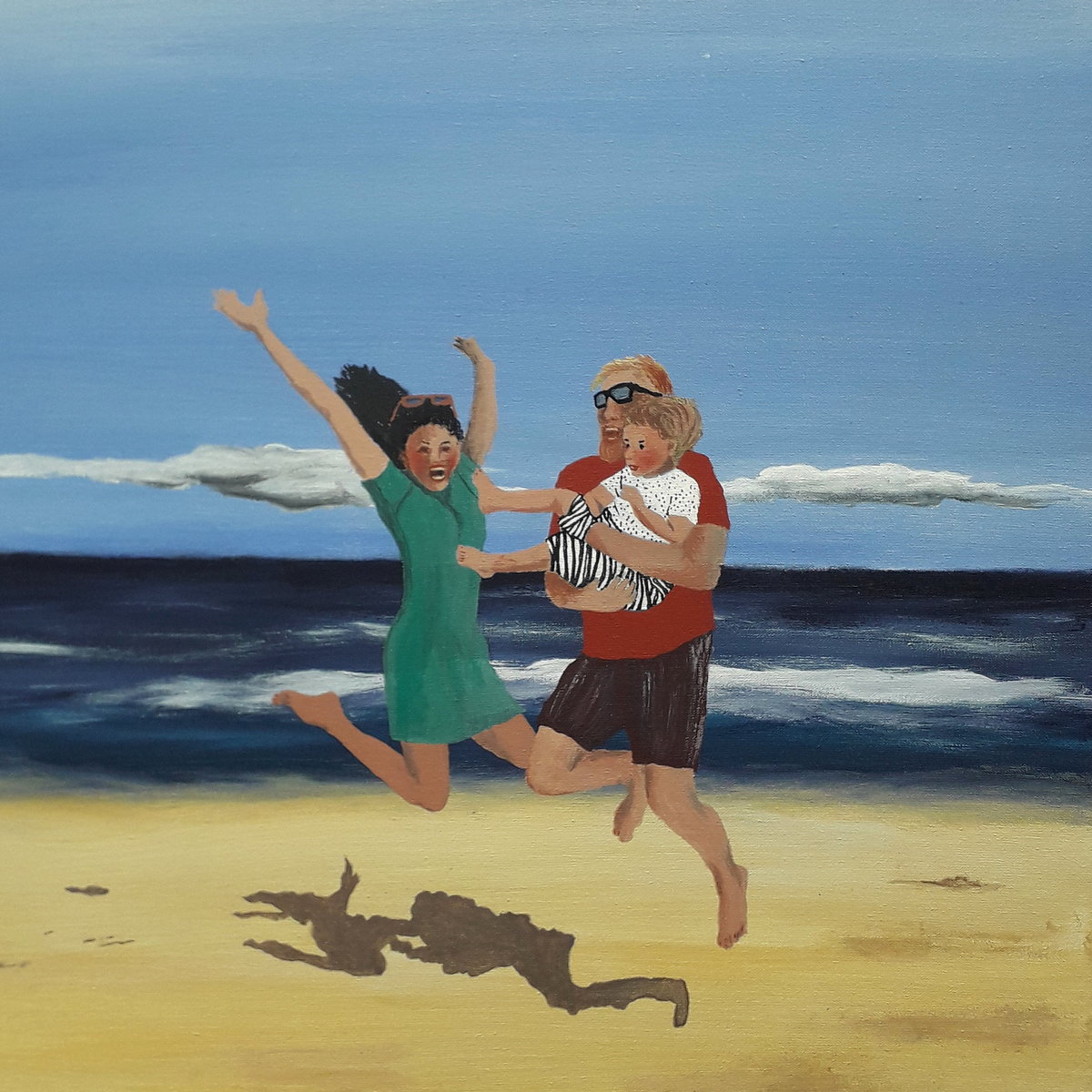 2 Person mit Kind, springend am Strand